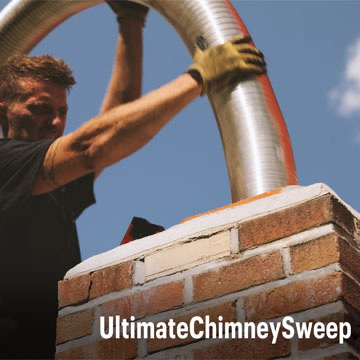 Ultimate Chimney Sweep technician installing a stainless steel chimney liner