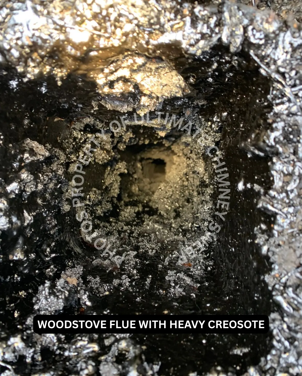 Heavy creosote buildup inside a chimney flue