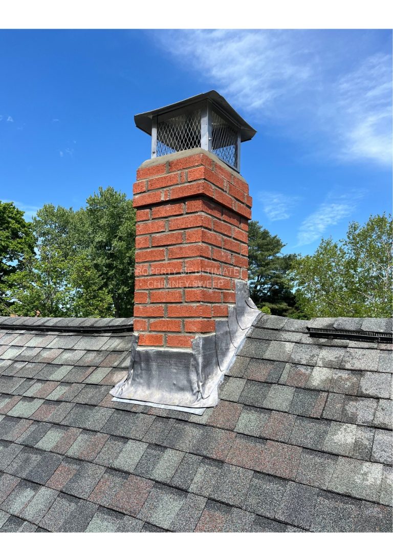 Rebuilt brick chimney with a new cap and flashing